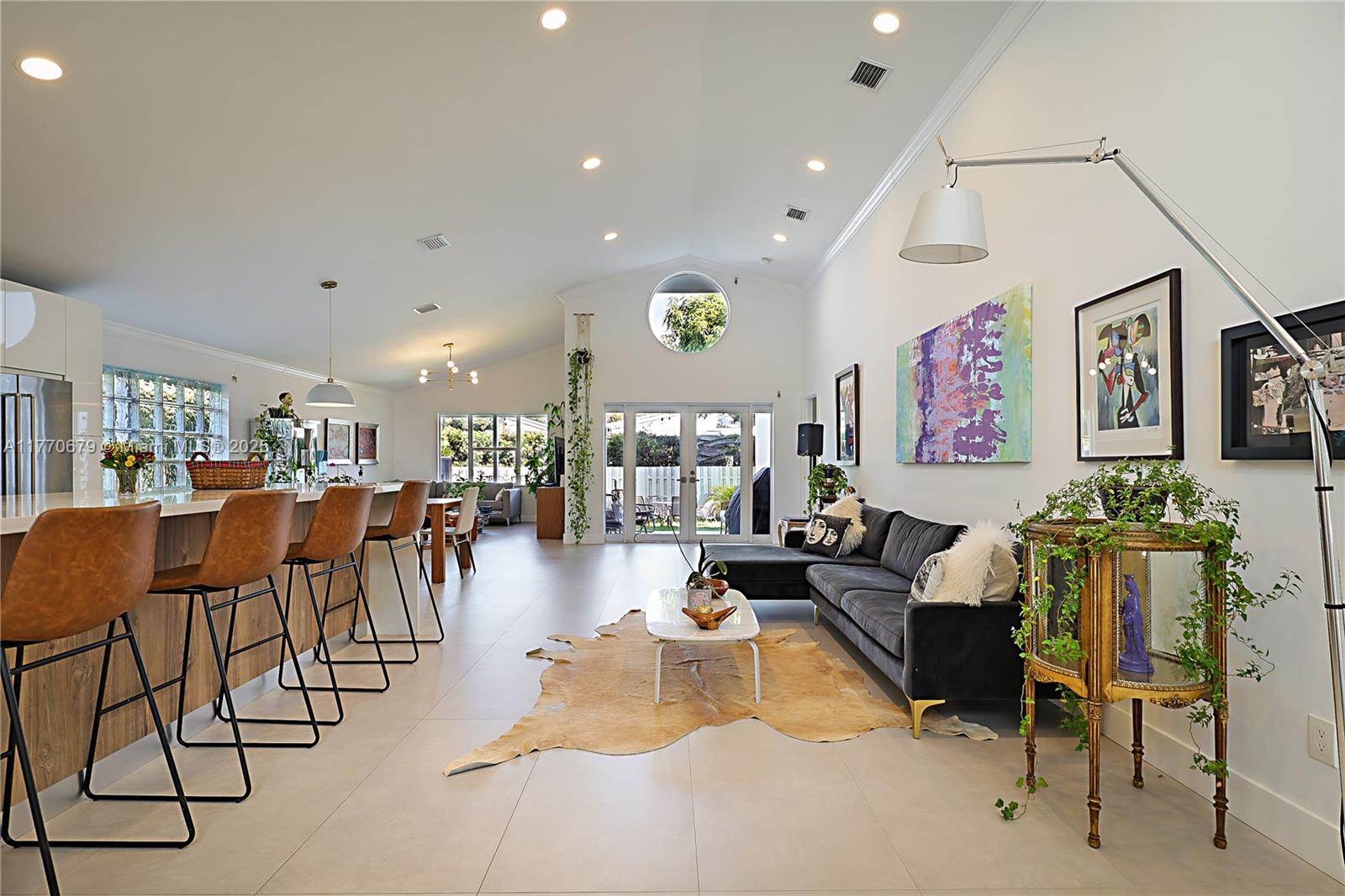 8919 Byron Avenue Surfside, FL 33154 - Photo 6 of 51 a living room with furniture and kitchen view