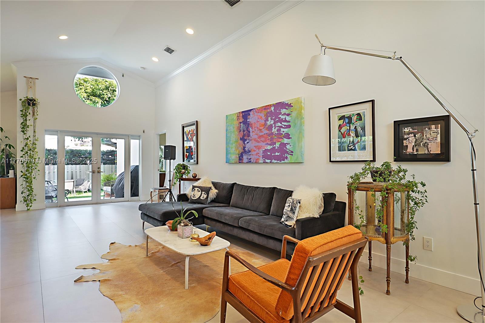 8919 Byron Avenue Surfside, FL 33154 - Photo 7 of 51 a living room with furniture and a large window