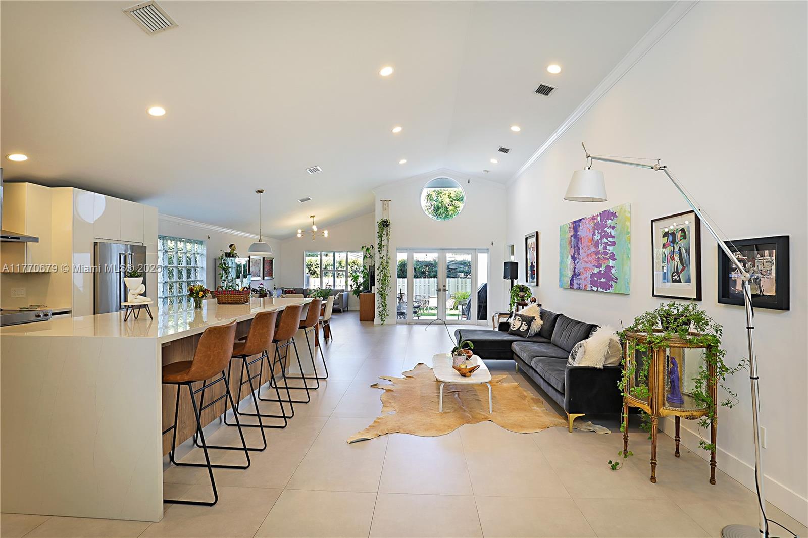 8919 Byron Avenue Surfside, FL 33154 - Photo 8 of 51 a living room with lots of furniture and view of kitchen