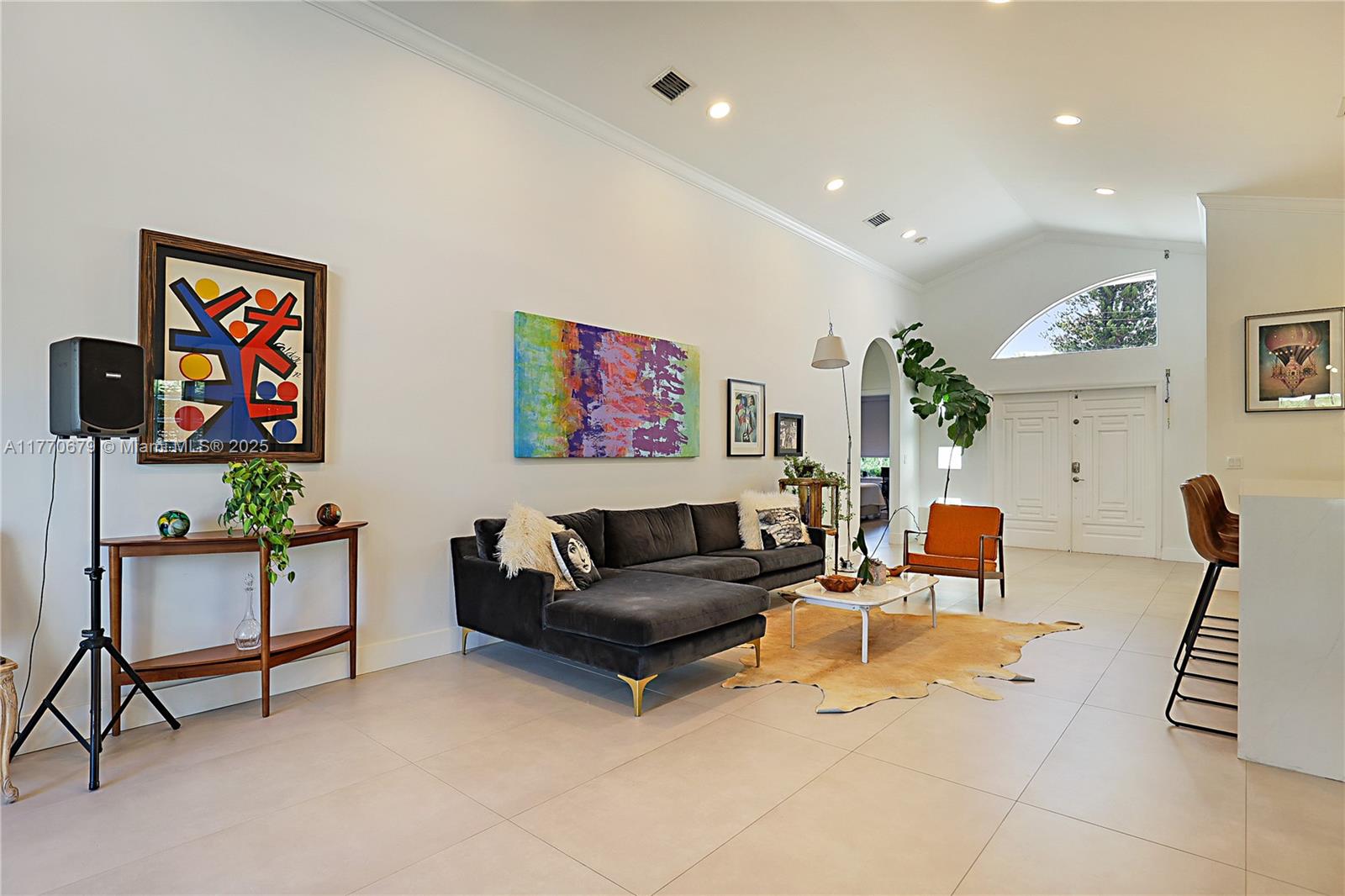 8919 Byron Avenue Surfside, FL 33154 - Photo 9 of 51 a living room with furniture and a flat screen tv