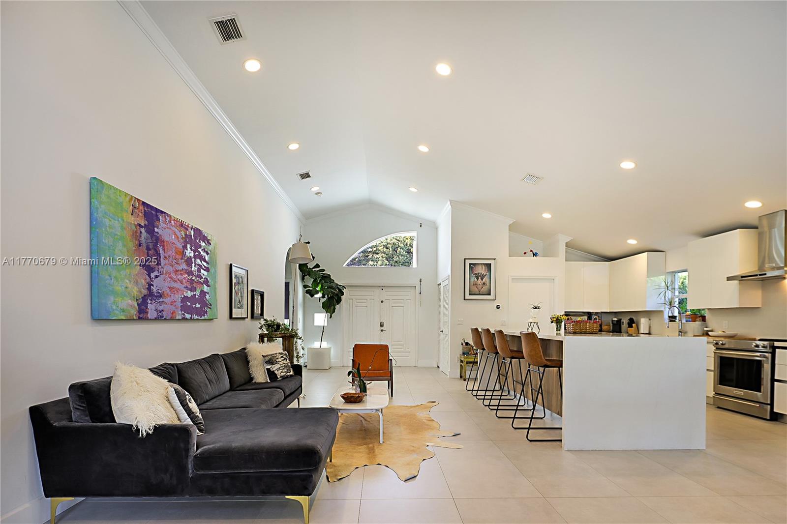 8919 Byron Avenue Surfside, FL 33154 - Photo 10 of 51 a living room with furniture and kitchen view