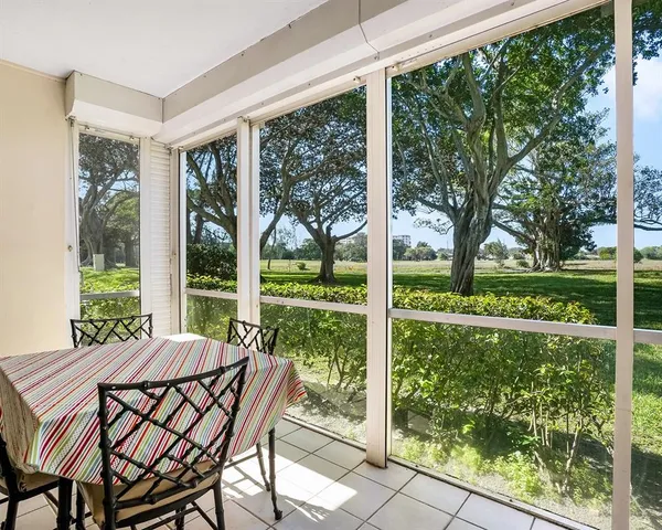 a view of an outdoor space with yard and furniture