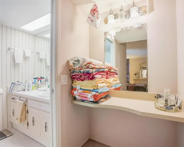 a bathroom with a sink a mirror and a shower curtain