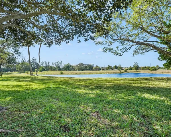 a view of a golf course with a lake view