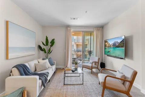 a living room with furniture and a flat screen tv