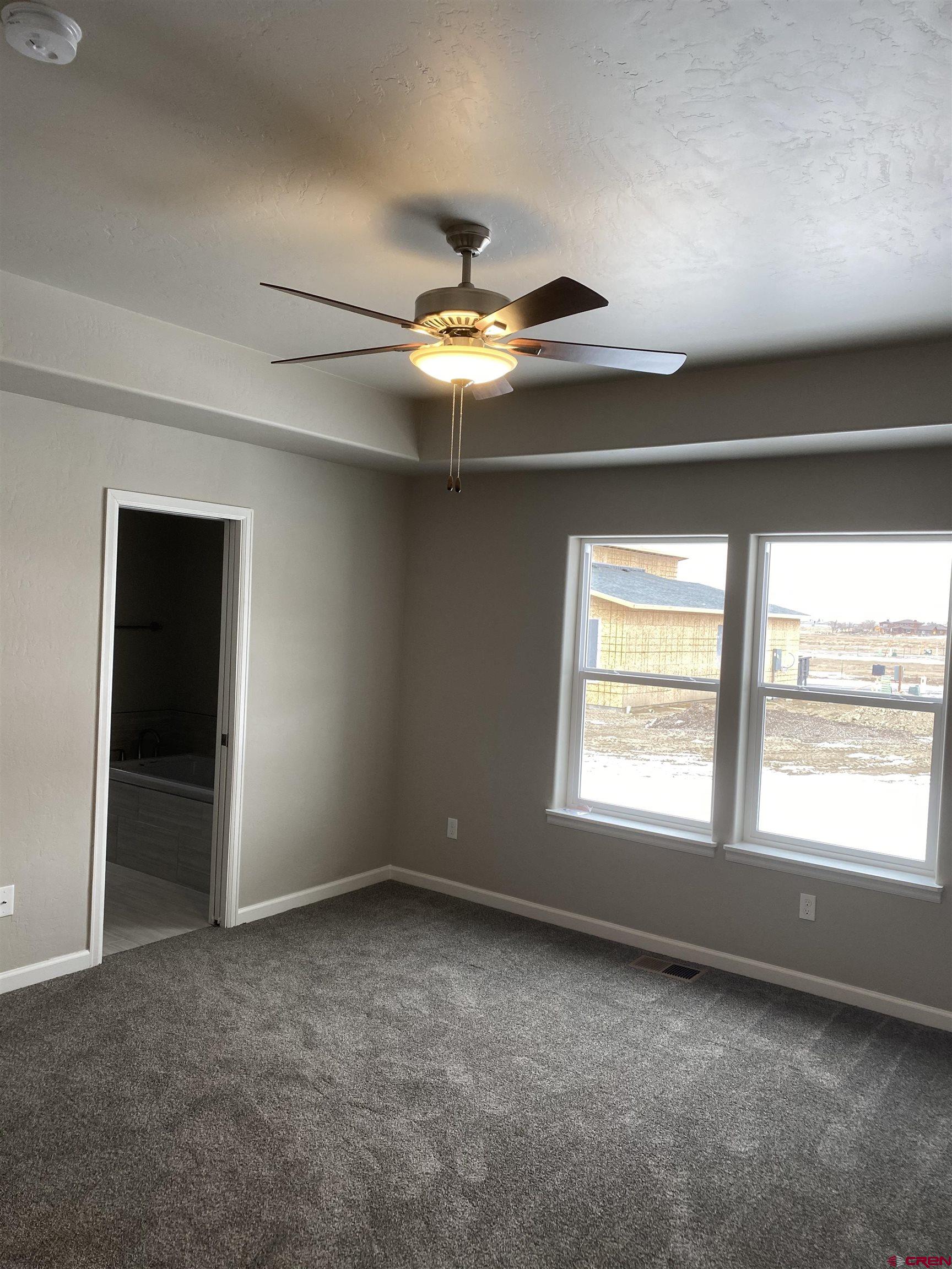 3674 Big Pines Loop Montrose, CO 81401 - Photo 13 of 19 a view of an empty room with a window
