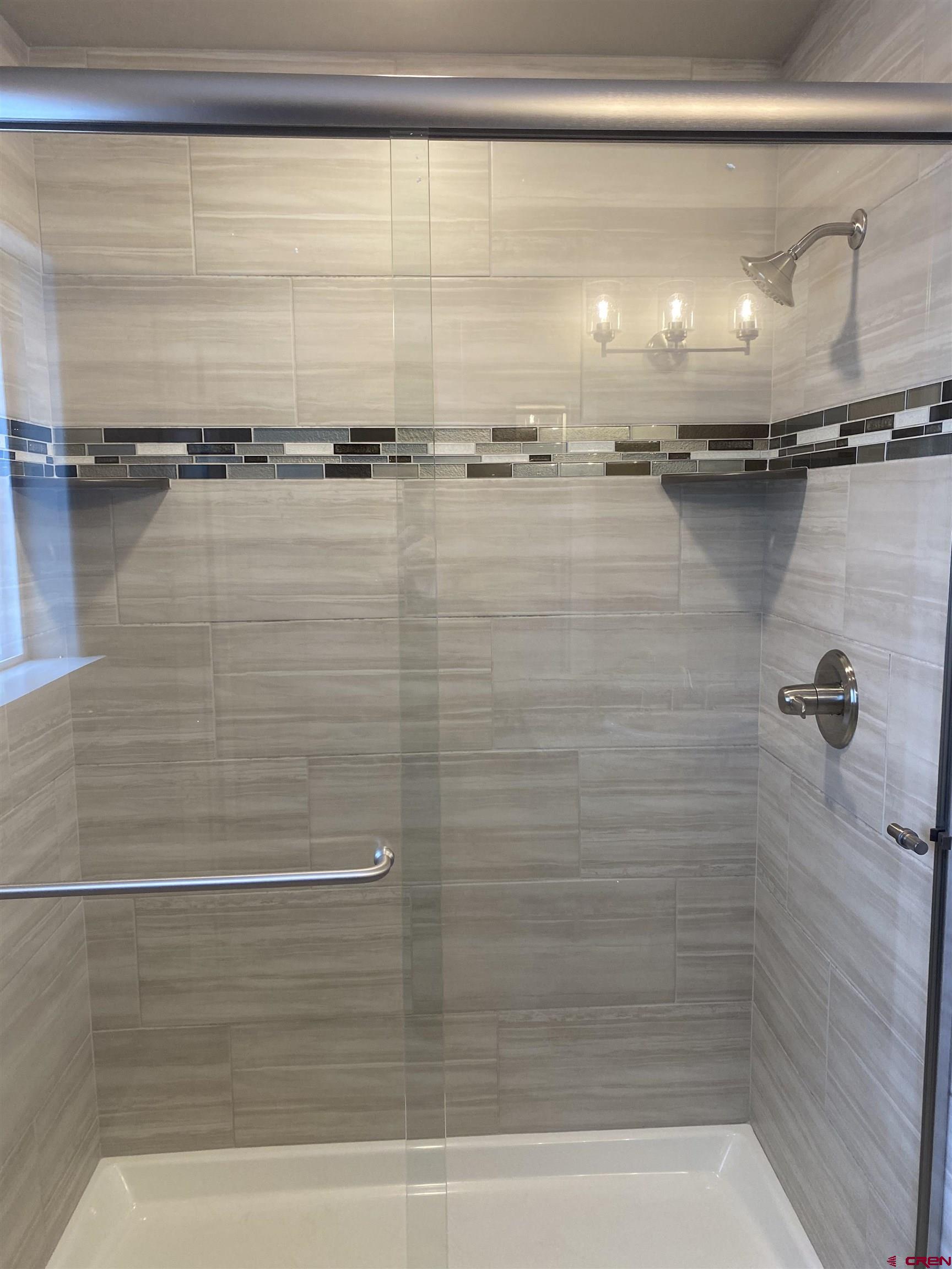 3674 Big Pines Loop Montrose, CO 81401 - Photo 16 of 19 a bathroom with a shower