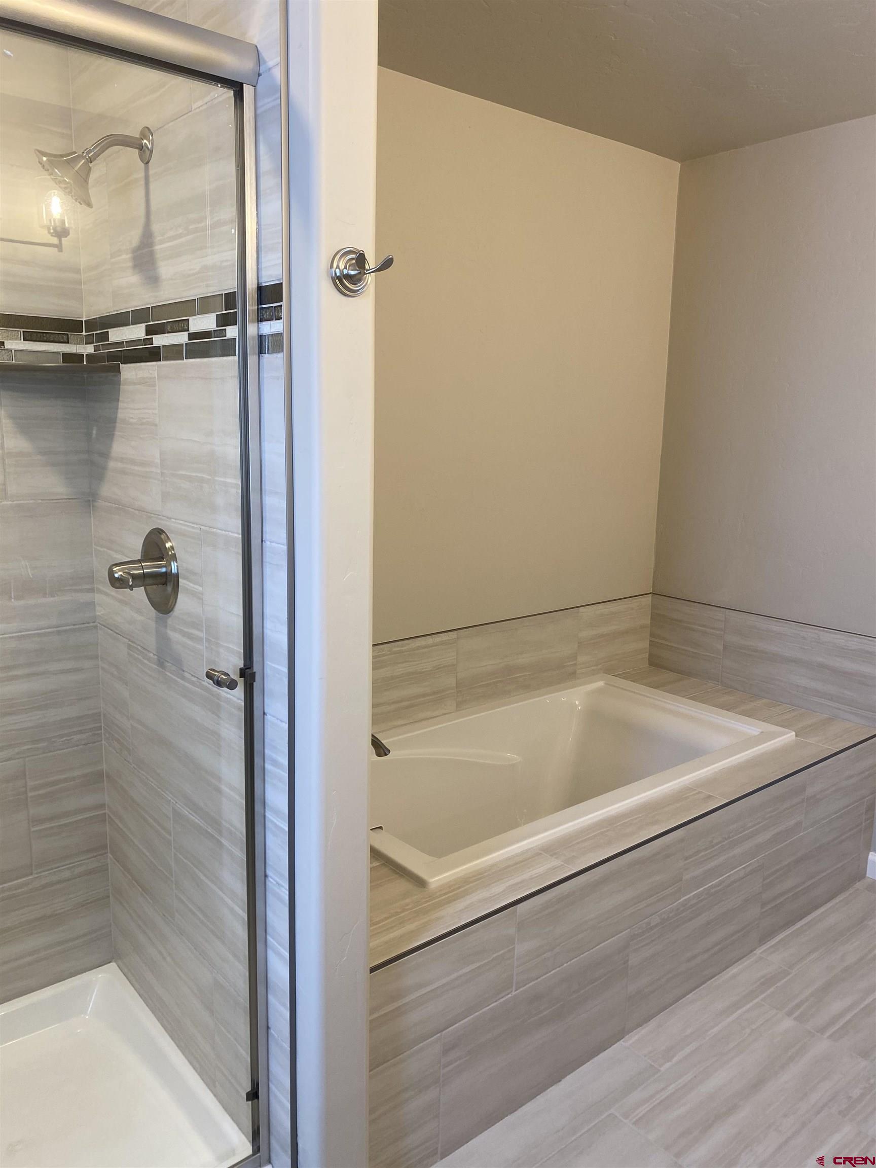 3674 Big Pines Loop Montrose, CO 81401 - Photo 17 of 19 a bathroom with a bathtub