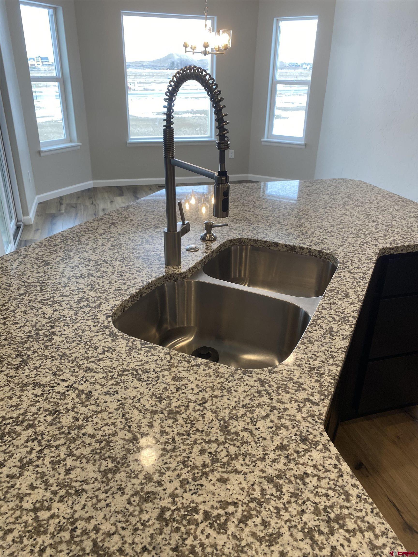 3674 Big Pines Loop Montrose, CO 81401 - Photo 4 of 19 a view of a sink and dishwasher with a mirror