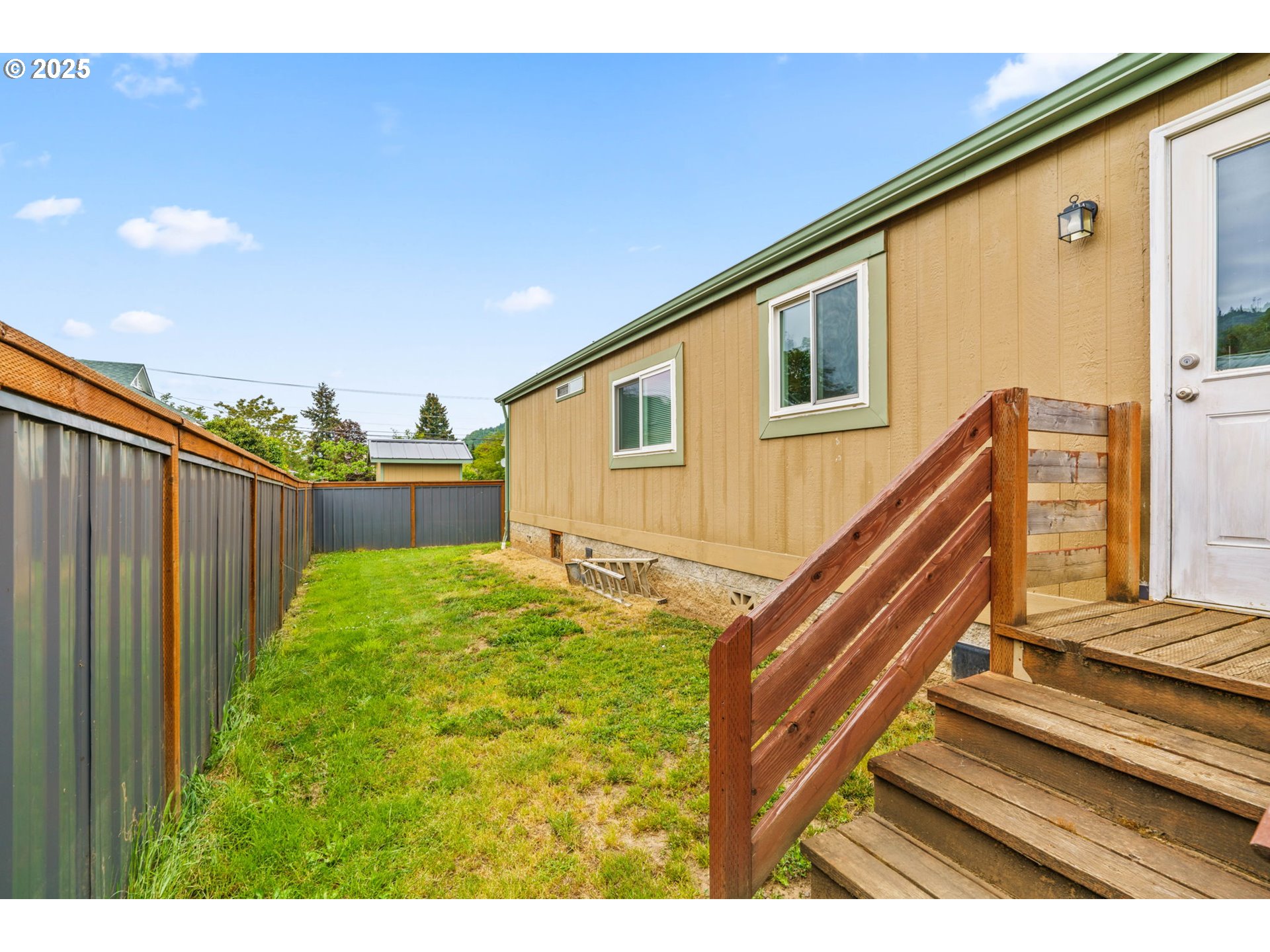 335 Division Avenue Drain, OR 97435 - Photo 23 of 25 a view of an house with backyard and deck