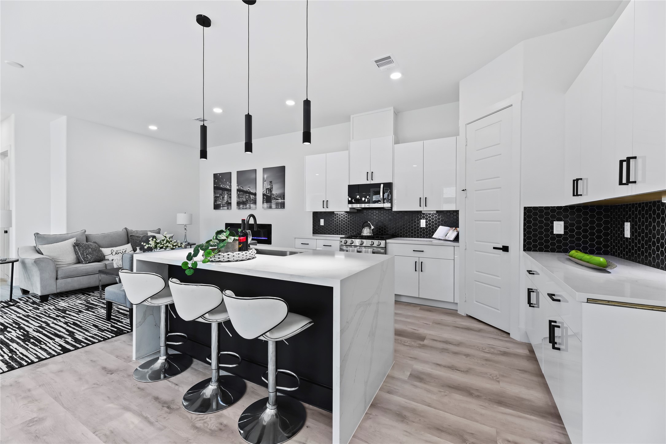 7210 England Street Houston, TX 77021 - Photo 20 of 37 a kitchen with stainless steel appliances kitchen island granite countertop a sink and a refrigerator