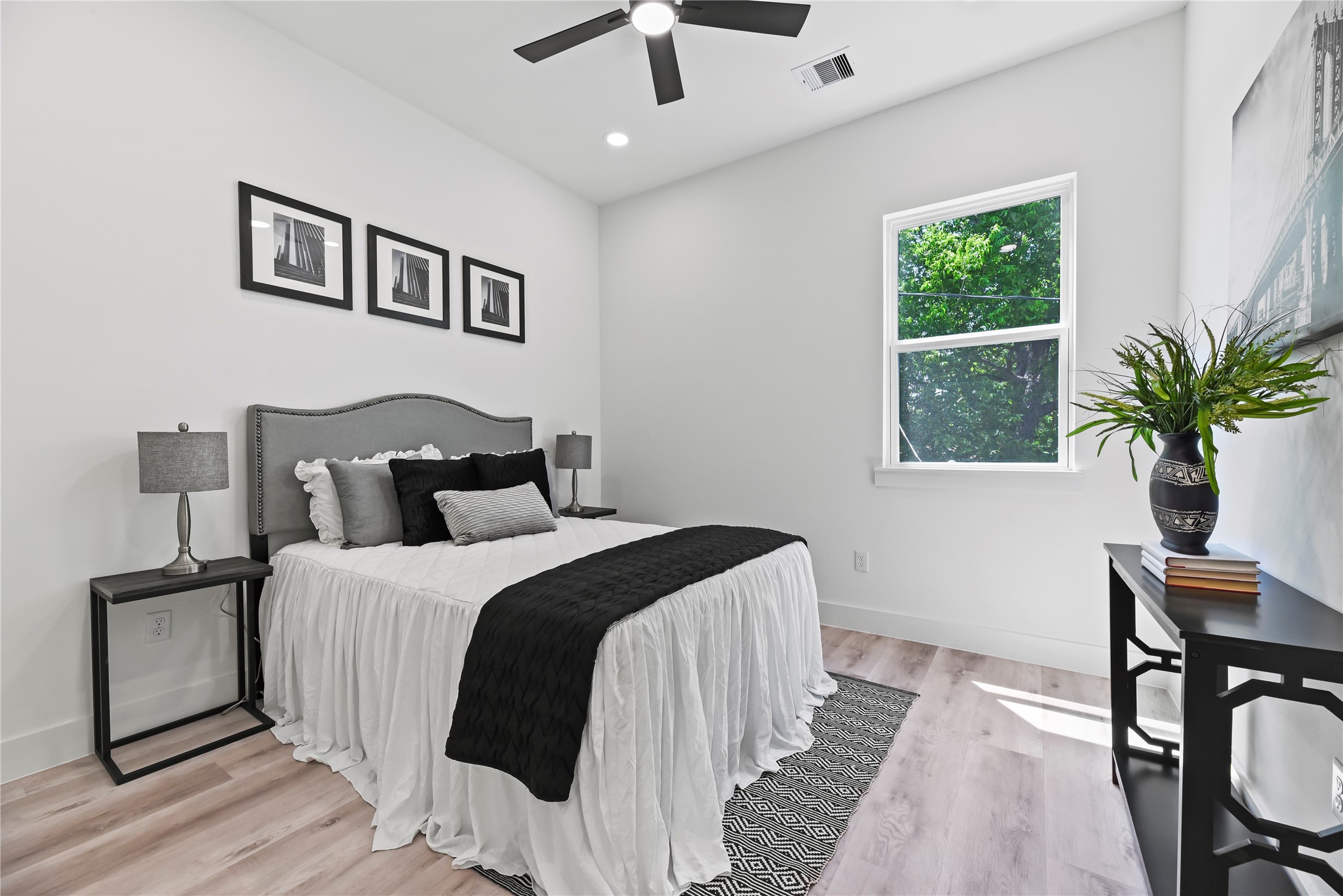 7210 England Street Houston, TX 77021 - Photo 25 of 37 a bedroom with a large bed and a window