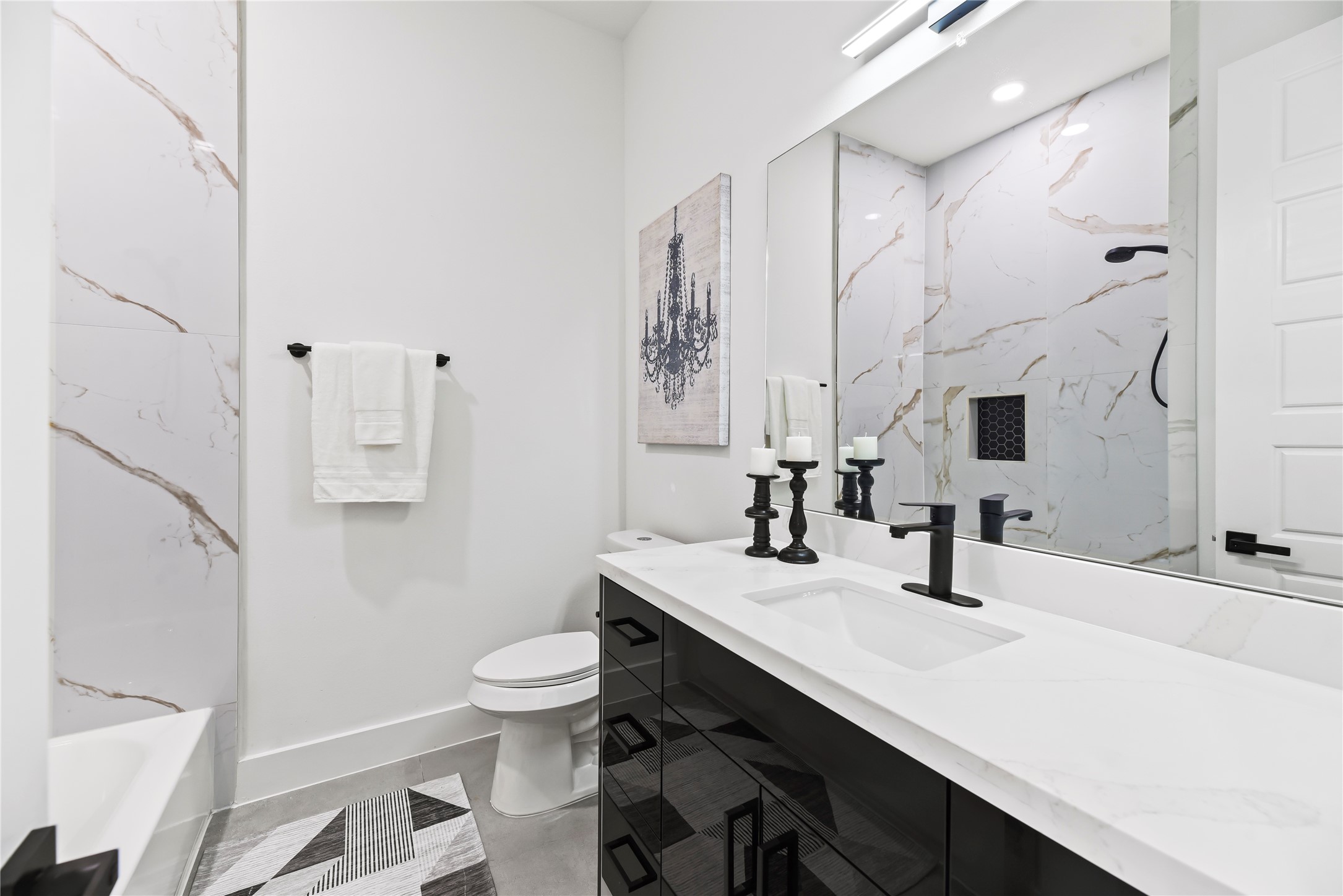 7210 England Street Houston, TX 77021 - Photo 27 of 37 a bathroom with a sink a toilet a mirror and shower