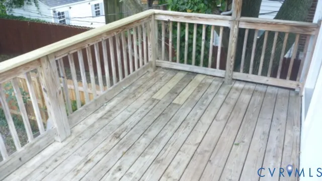 a view of balcony with wooden floor