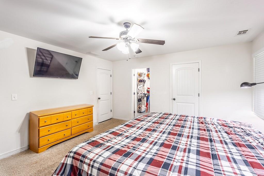 3907 Robin Court Acworth, GA 30101 - Photo 14 of 29 a bedroom with a bed and a tv in it