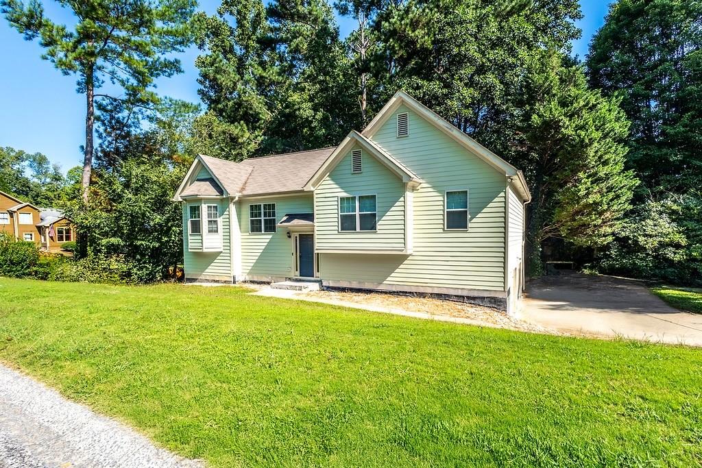 3907 Robin Court Acworth, GA 30101 - Photo 2 of 29 a front view of a house with yard and green space