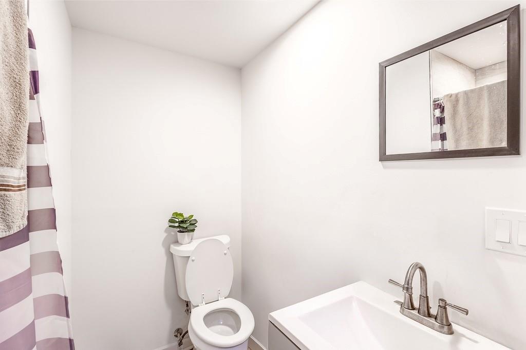 3907 Robin Court Acworth, GA 30101 - Photo 21 of 29 a bathroom with a toilet and a sink