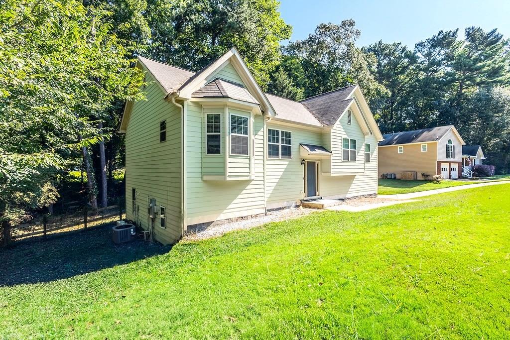 3907 Robin Court Acworth, GA 30101 - Photo 29 of 29 a front view of a house with yard and green space