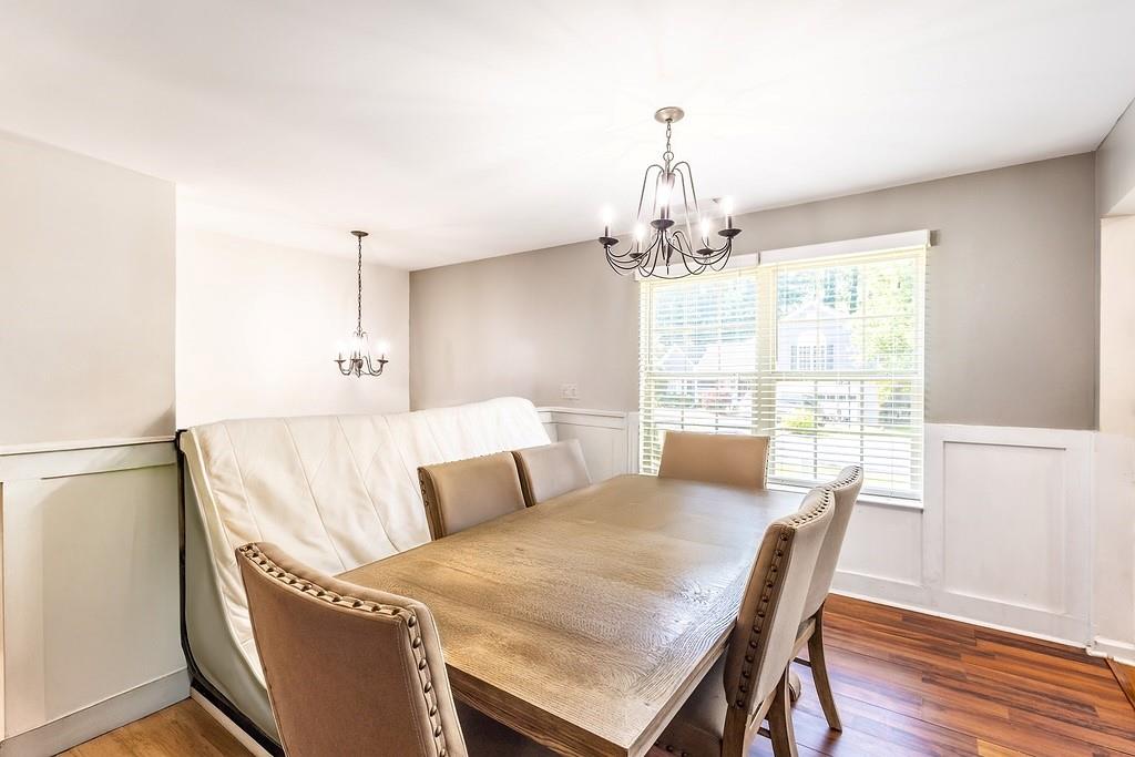 3907 Robin Court Acworth, GA 30101 - Photo 5 of 29 a view of a dining room with furniture wooden floor and chandelier
