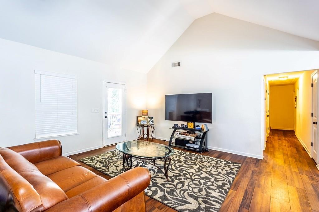 3907 Robin Court Acworth, GA 30101 - Photo 10 of 29 a living room with furniture and a flat screen tv