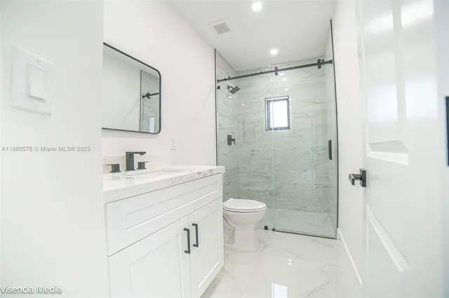 a view of a hallway with white walls