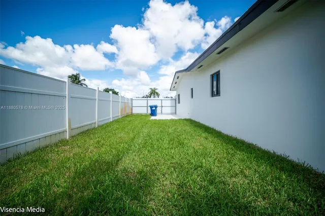 a view of backyard with green space