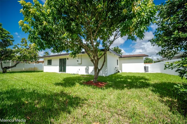 a view of yard in front of house with yard