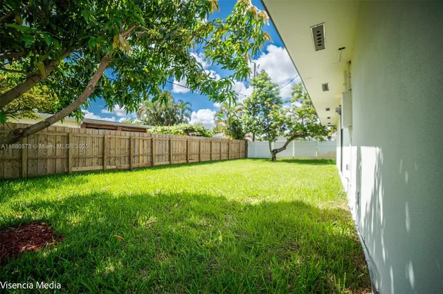 an aerial view of multiple houses with yard