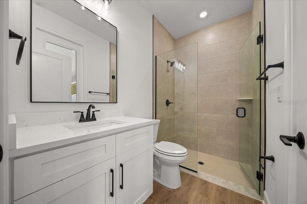 11088 Fulton Avenue Weeki Wachee, FL 34613 - Photo 6 of 63 a bathroom with a sink a toilet and shower