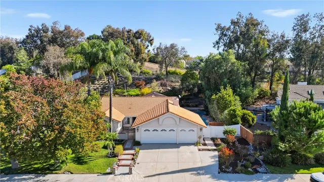 an aerial view of houses with yard