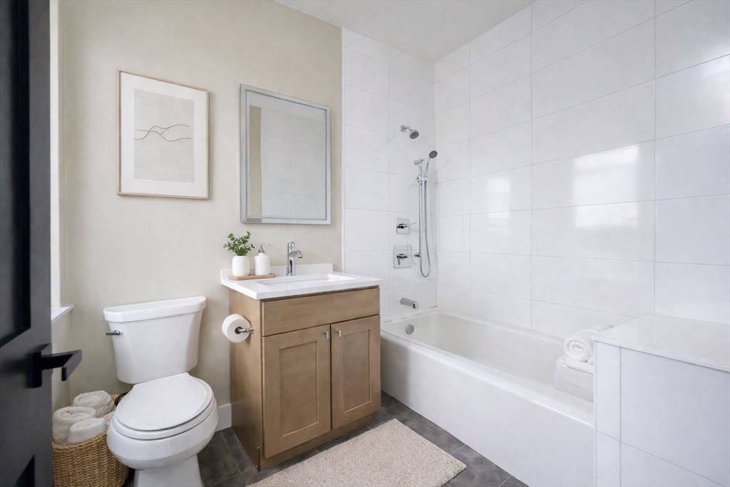 21 Tanglewood Road, Unit 3 Boston, MA 02126 - Photo 12 of 22 a bathroom with a sink toilet and bathtub