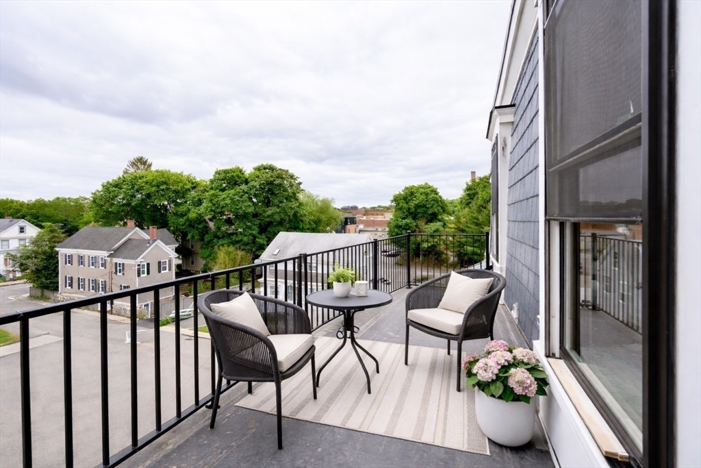 21 Tanglewood Road, Unit 3 Boston, MA 02126 - Photo 14 of 22 a view of balcony with furniture