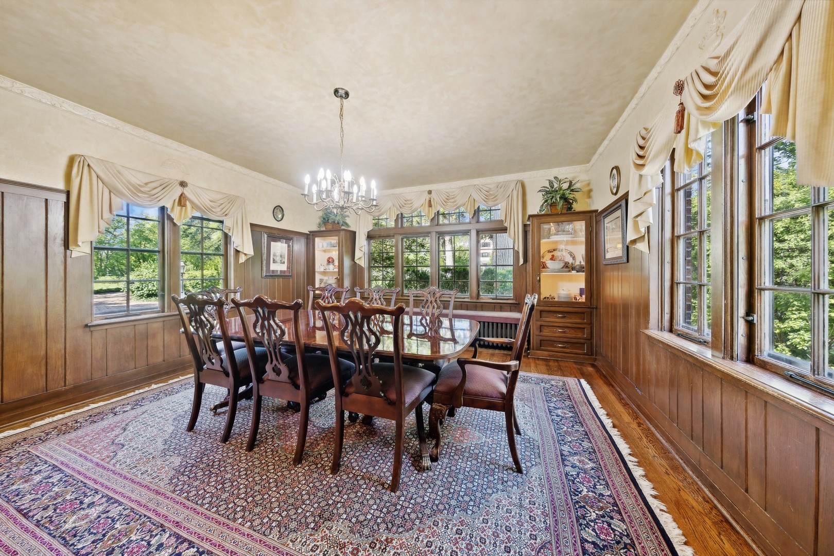 719 South County Line Road Hinsdale, IL 60521 - Photo 14 of 52 a view of a dining room with furniture window and wooden floor