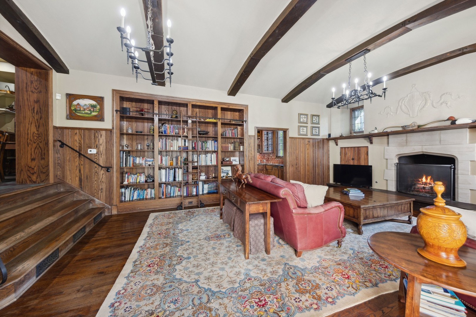 719 South County Line Road Hinsdale, IL 60521 - Photo 19 of 52 a living room with furniture fireplace and flat screen tv