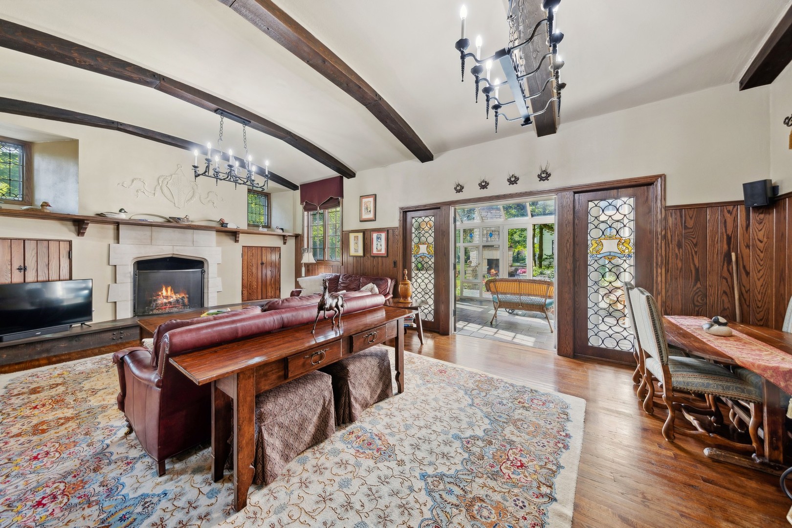 719 South County Line Road Hinsdale, IL 60521 - Photo 22 of 52 a living room with furniture a fireplace and a table
