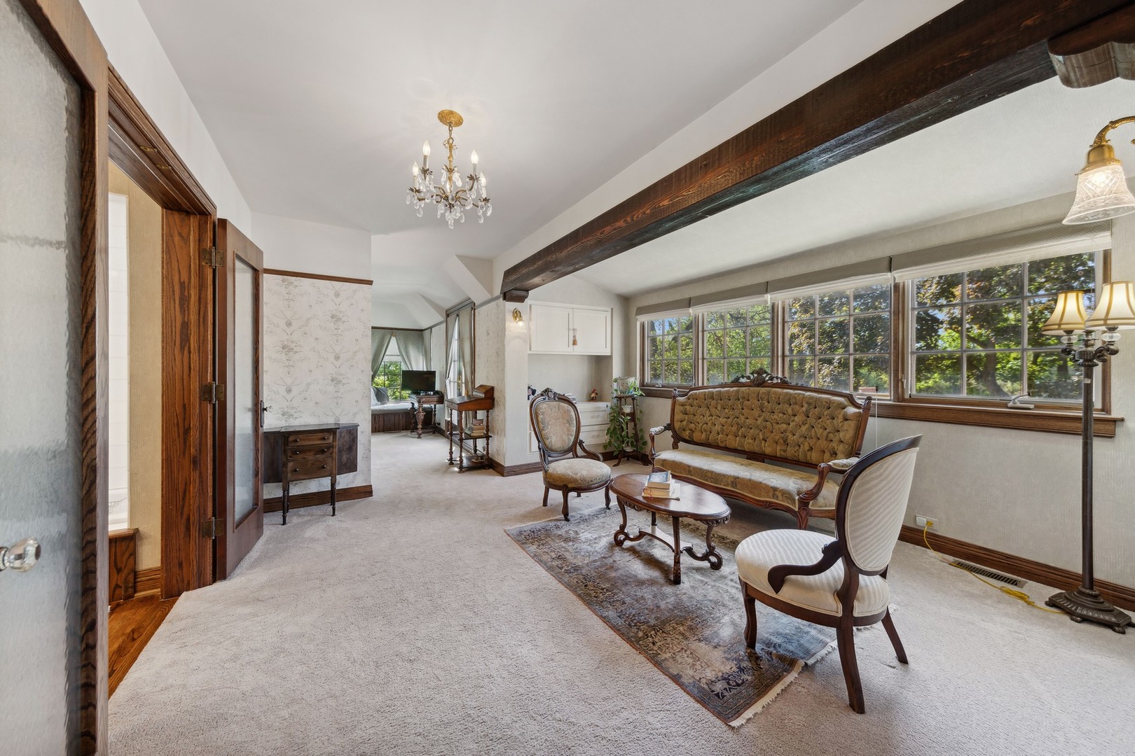 719 South County Line Road Hinsdale, IL 60521 - Photo 31 of 52 a living room with furniture a fireplace and large windows