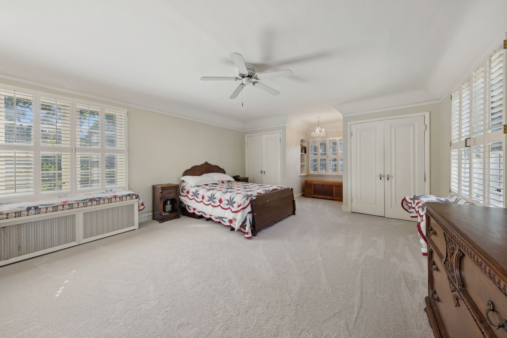 719 South County Line Road Hinsdale, IL 60521 - Photo 33 of 52 a spacious bedroom with a bed and a large window