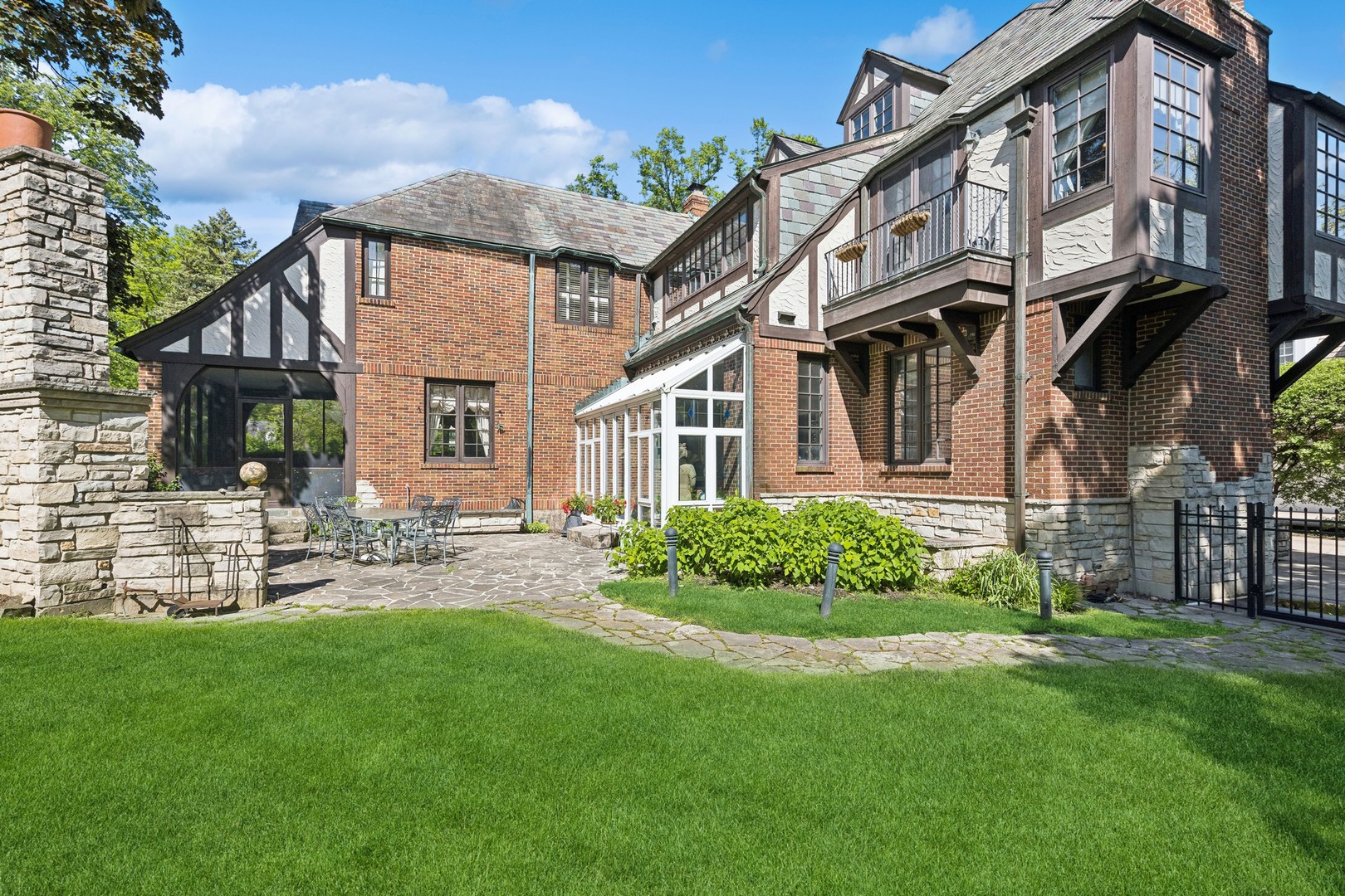 719 South County Line Road Hinsdale, IL 60521 - Photo 45 of 52 a view of a house with a yard and sitting area