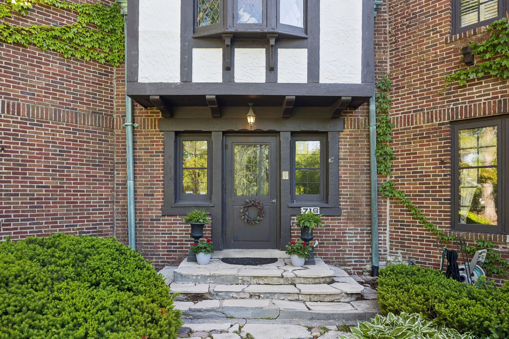 719 South County Line Road Hinsdale, IL 60521 - Photo 5 of 52 a view of a brick house with a large windows