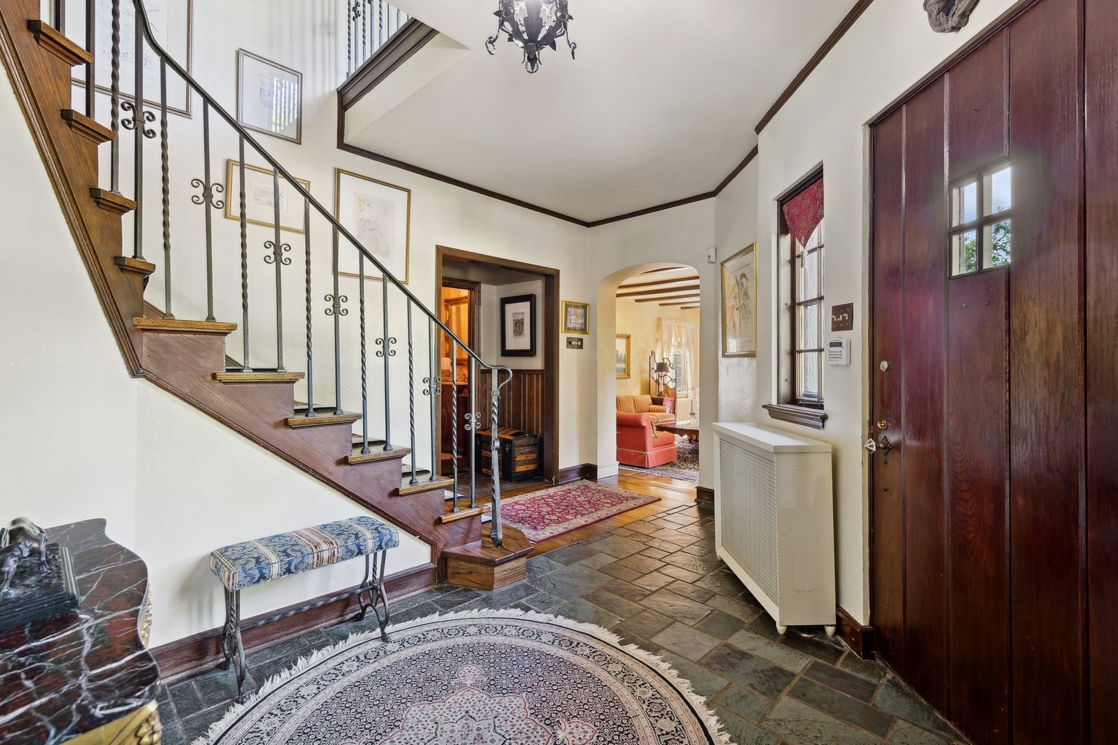 719 South County Line Road Hinsdale, IL 60521 - Photo 6 of 52 a view of a livingroom with furniture and stairs