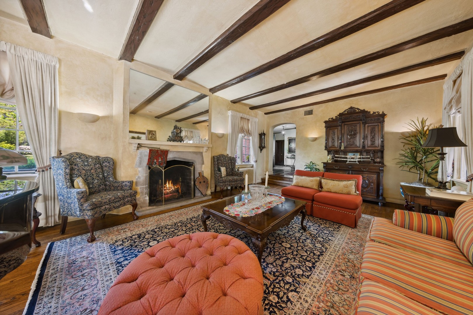 719 South County Line Road Hinsdale, IL 60521 - Photo 9 of 52 a living room with furniture and a fireplace