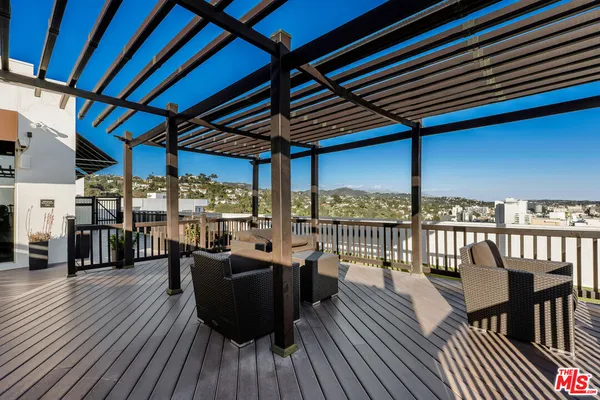 a view of a balcony with wooden floor