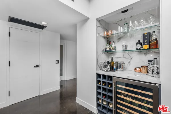 a view of kitchen cabinet with food and wooden floor