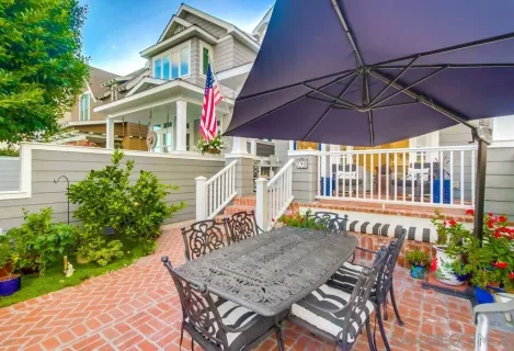 a view of a house with swimming pool and sitting area