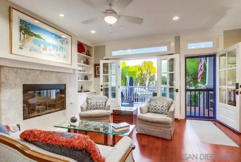 a kitchen with stainless steel appliances granite countertop a stove a sink a microwave a dining table and chairs