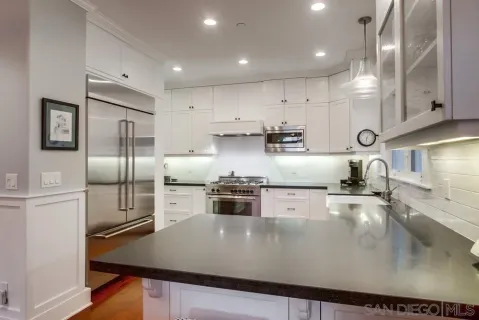 a bedroom with a large bed and a large window