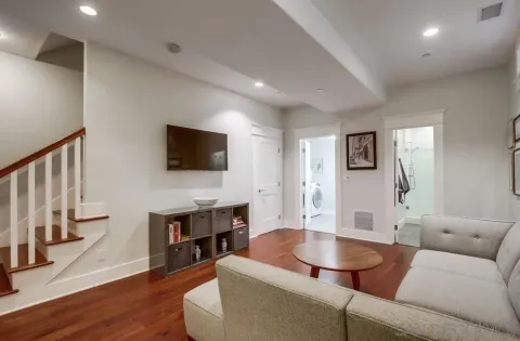 a view of a livingroom with furniture hardwood floor and a ceiling fan
