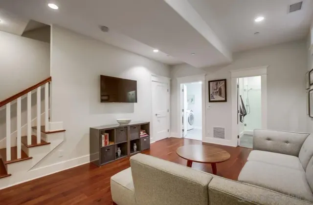 a view of a livingroom with furniture hardwood floor and a ceiling fan