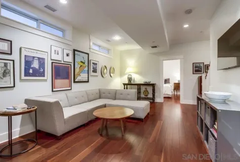 a workspace with furniture window and wooden floor