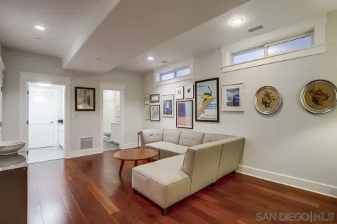 a view of a livingroom with furniture and wooden floor